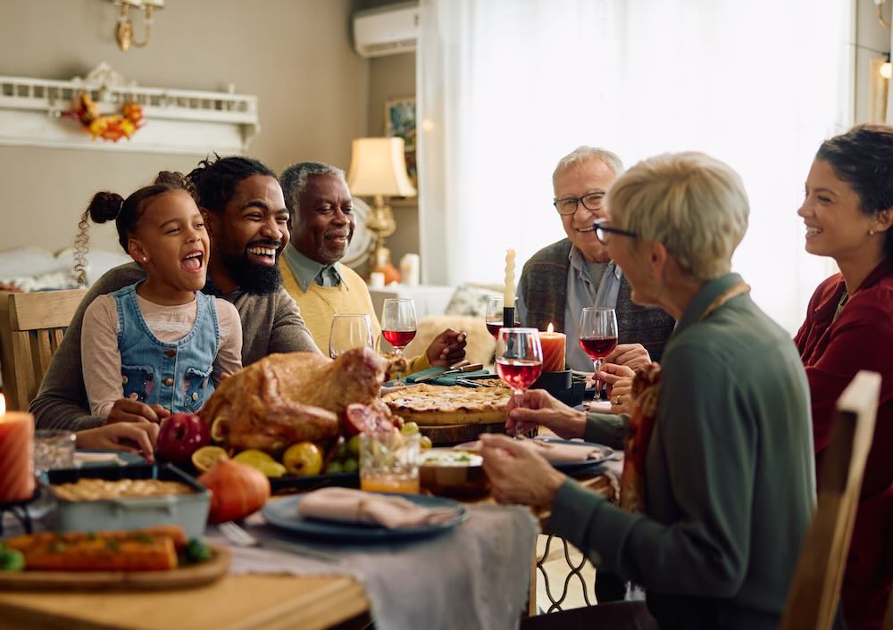 Family Thanksgiving dinner with a couple, their children and parents present