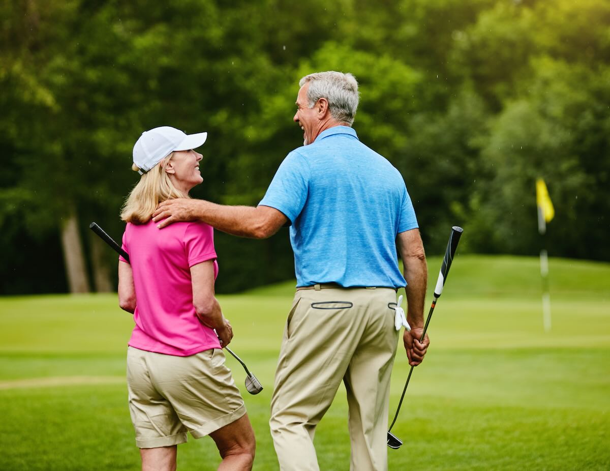 Senior couple playing golf